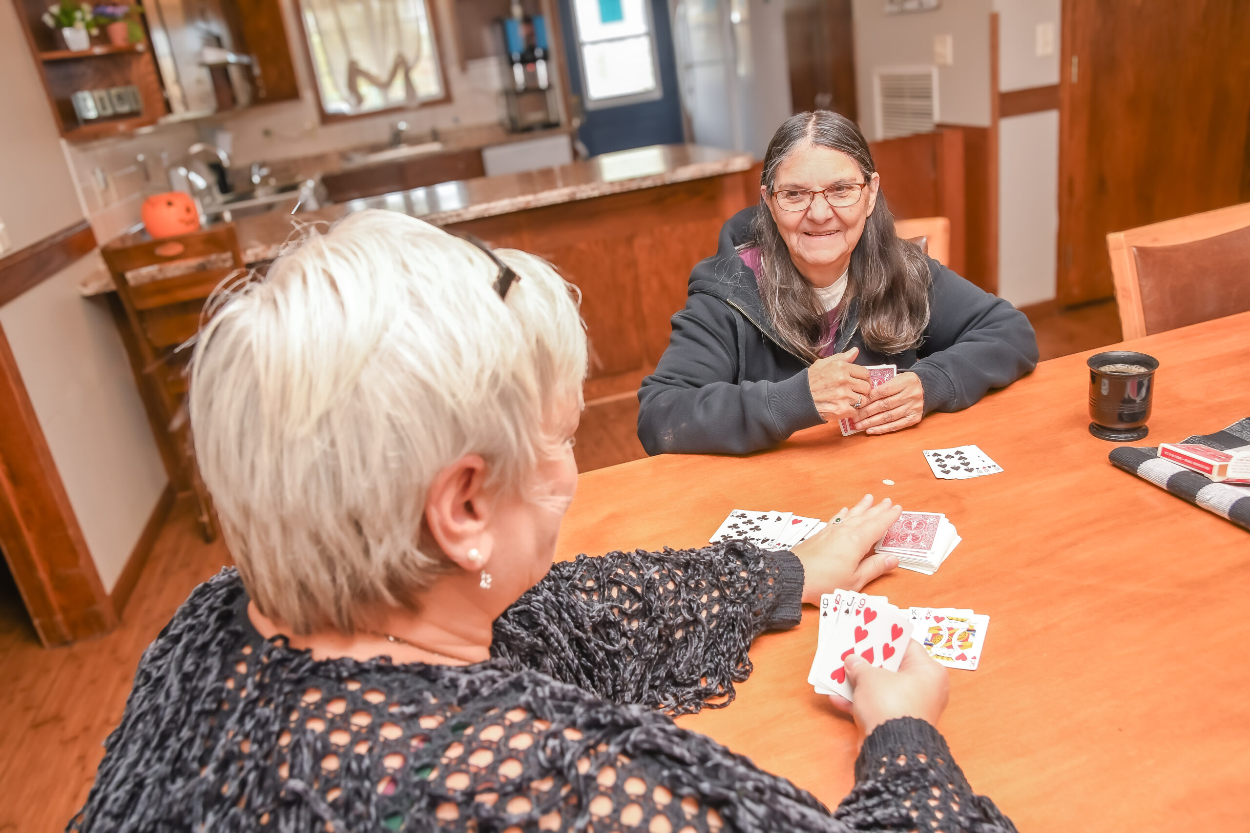 Autumn Cottages residents playing cards