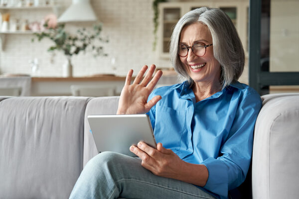 Woman using home health care technology to video call