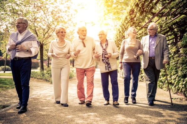 Group of older adult people walking outdoors